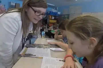 A Fredonia student teaches children in a local classroom