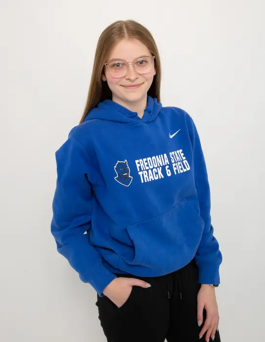 Student in the College of Liberal Arts and Sciences Haley Mercer in their Fredonia hoodie