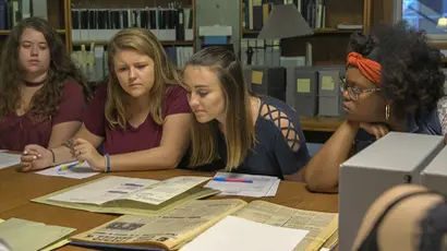 Fredonia students study archival information. Degree in journalism, journalism degree, journalism major,  journalism broadcasting. 