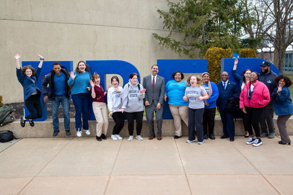 students in front of FRED sign with Chancellor King