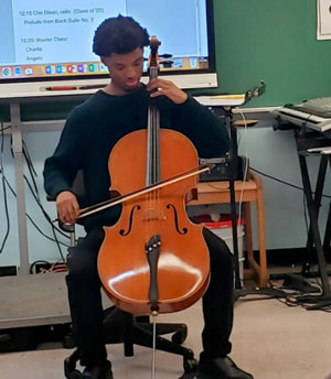 Che Dixon rehearses on the cello
