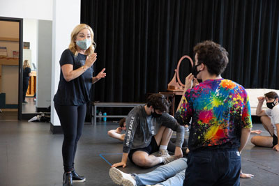 Jennifer Cody works with students in rehearsal