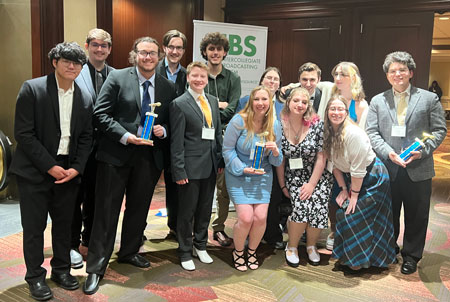 Gathering for a group photo at the IBS conference are FRS staffers (front row, from left): Yongjo (Brian) Shin, Alexander (Alex) Erwin, Lee Pye, Chloe Kowalyk, Isabella (Izzie) Inzinna, Heather Leonardi and Daniel (Dan) Granados; (back row): Joshua (Josh) Ribakove, Hunter Halterman, Justin Malinowski, Kelly Ibach, Matthew (Matt) Volz and Abigail (Abby) Jefferys.