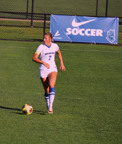 student playing soccer