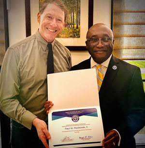 SUNY Distinguished Teaching Professor Paul Mockovak with SUNY Fredonia President Stephen H. Kolison Jr.