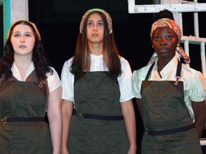 three women cast members in working clothes