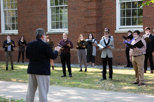 director with choir students