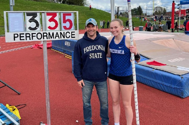 Coach Tom Wilson and pole vaulter Cara Pellechia