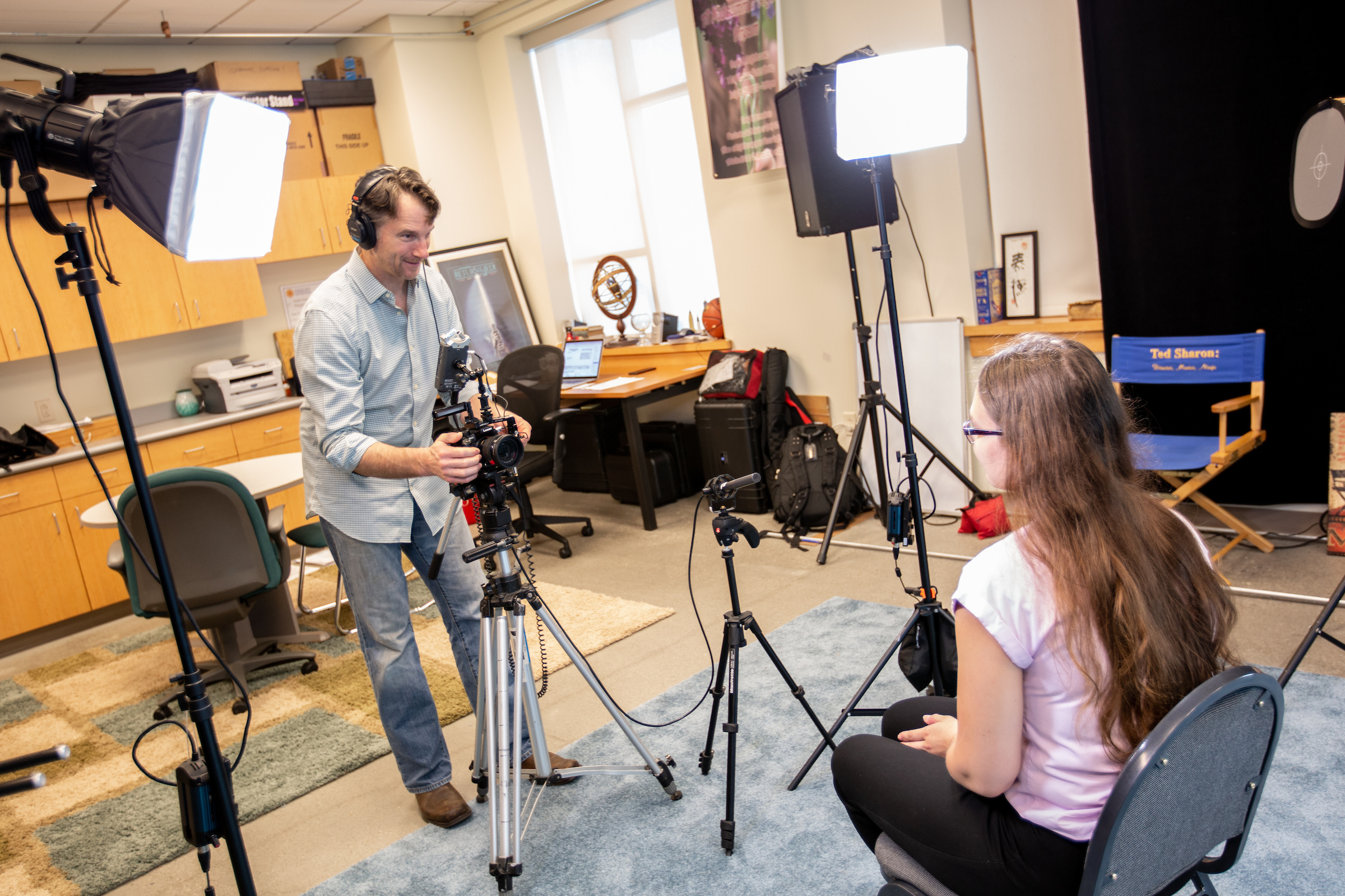 Professor Ted Sharon works with a student.