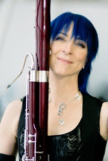 bassoonist holding instrument