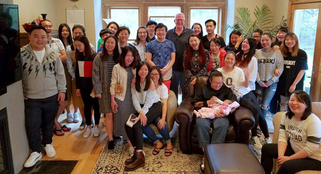Barry Kilpatrick with international music students gathering at the Kilpatrick home in May 2018.