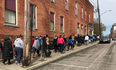 students cleaning up the village