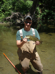 Nick Sard Holding a Bass