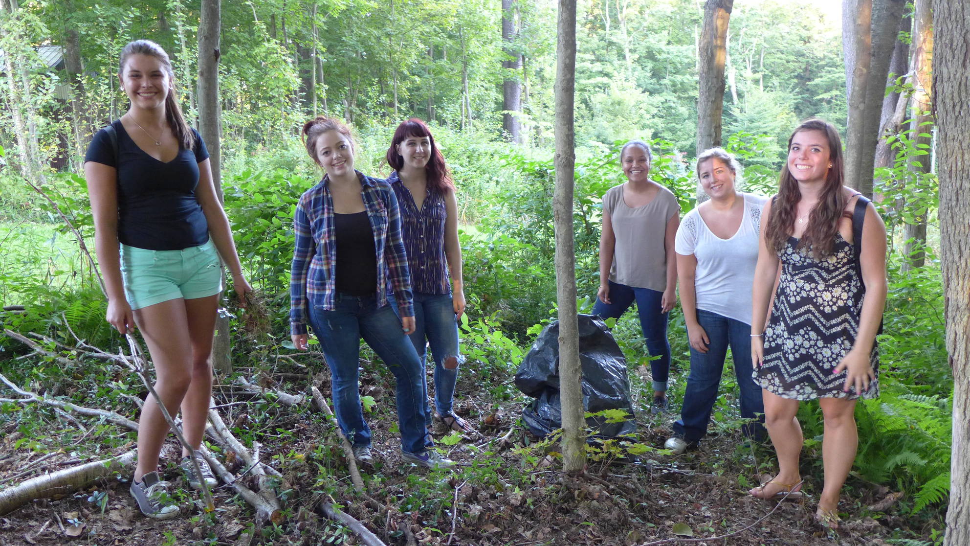 Students in the woods at the College Lodge 