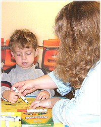 Preschool child working on colors and shapes