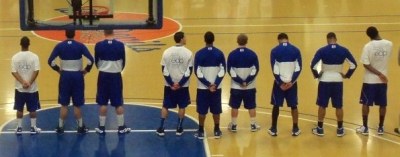 EDP students on the men's basketball team wear their EDP t-shirts