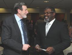 Fredonia President Dr. Hefner greets EDP Distinguished Alum Gino Morrow