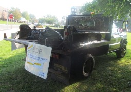 Fredonia's Facilities Service/Grounds Crew helps haul away the litter.