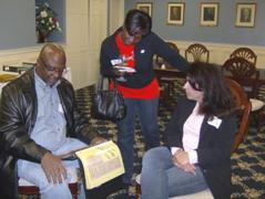 Alums look over the scrapbooks