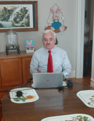 Igoe working in his dining room