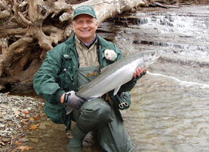 Image of Jim Zak and steelhead trout in Canadaway Creek