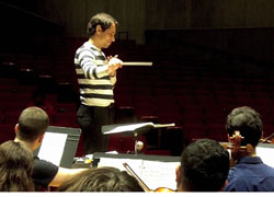 Andre Lousada directs rehearsal for the Fredonia College Symphony