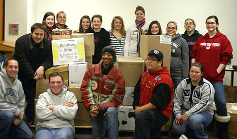 Students and staff with donations for the Holiday Caregivers Coalition