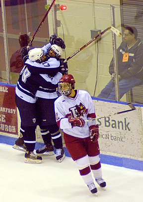 Photo of a championship hug