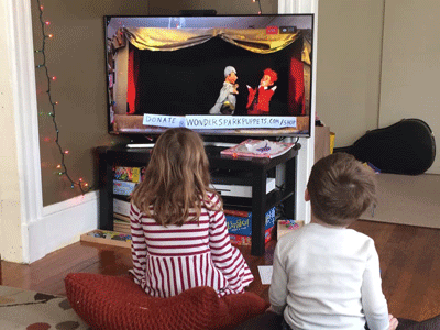 children watch puppets using streaming video