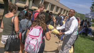 Vice President Cedric Howard passes out popcorn