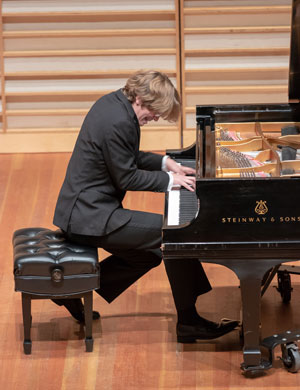 Mr. Yoder playing piano