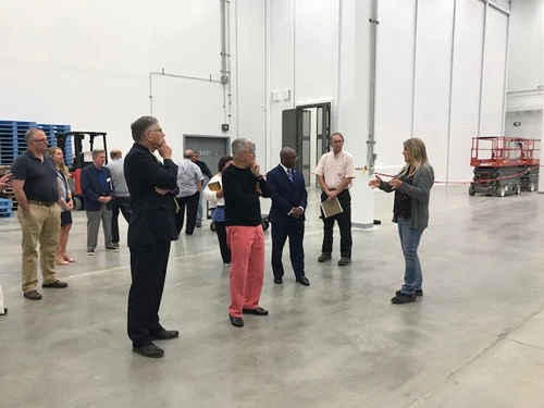 staff taking tour of new plant