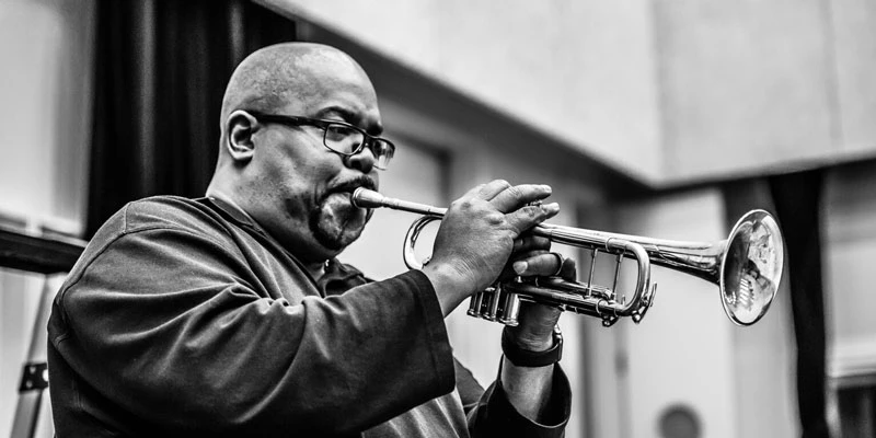 Derrick Gardner playing his trumpet