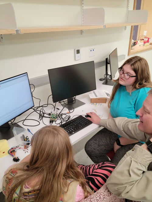Girl Scouts in robotics lab