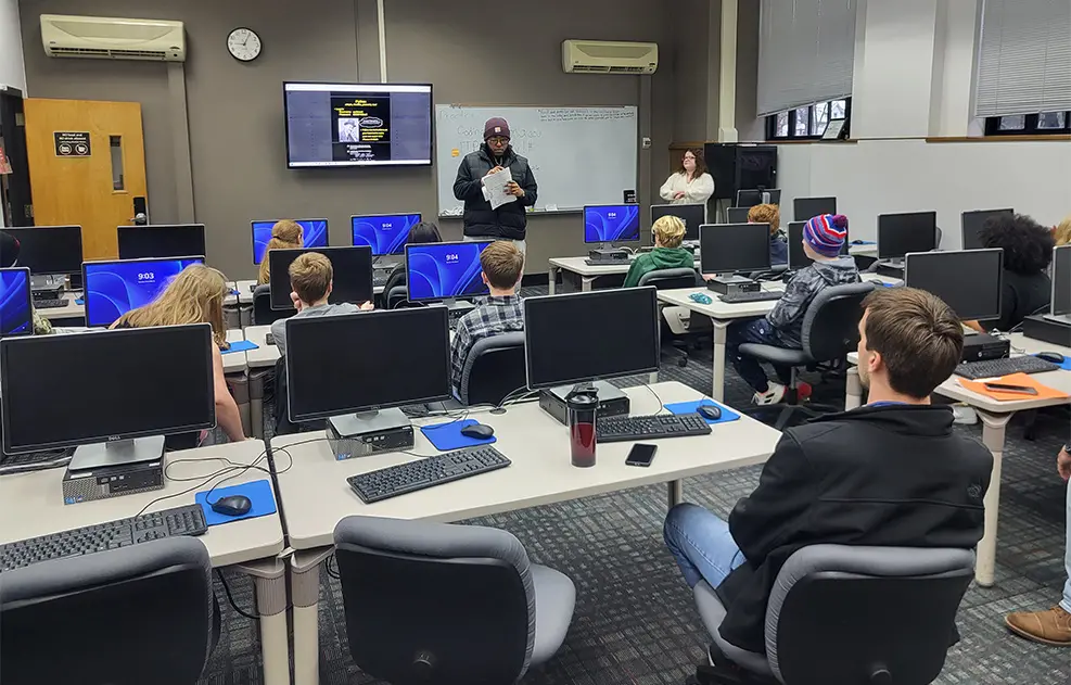 Cameron Showard and Anne Smith with Silver Creek students.