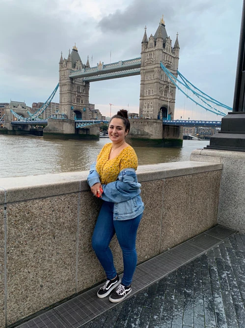 student standing in front of Tower Bridge in London