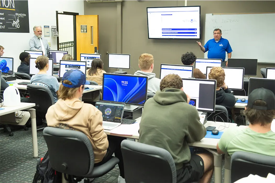 Chris LaGrow (right), with Computer and Information Sciences Adjunct Lecturer Gregory Cole, in his CSIT 251 class.