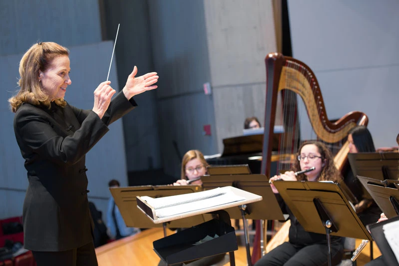 Dr. Paula Holcomb conducts the Wind Ensemble