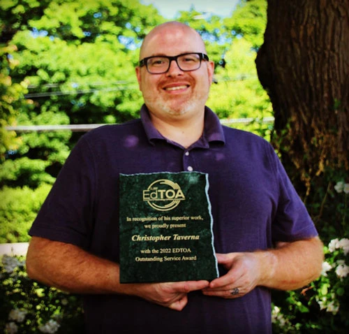 Christopher Taverna with plaque