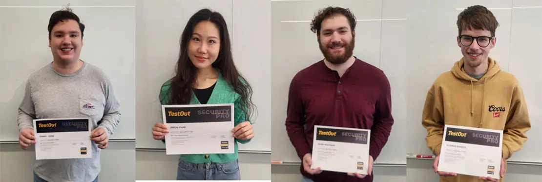 Displaying their TestOut Security Pro Certifications are (left to right): Daniel Senn, Jiwon Chae, Mark Hoffman and Norman Barker 