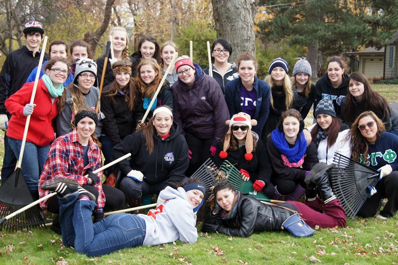 picture of students and lawn rakes