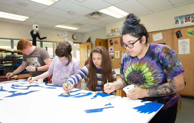 Art Forum students partnership with middle schoolers to create school mural Fredonia.edu
