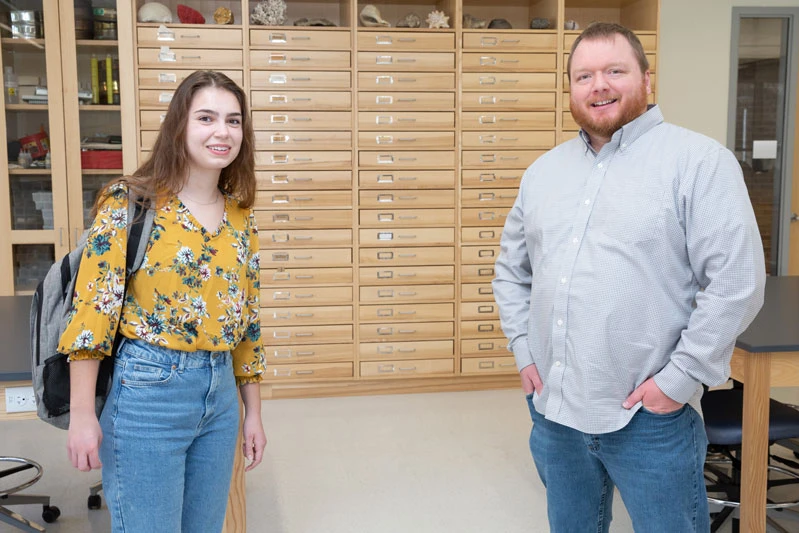 student and faculty member in lab