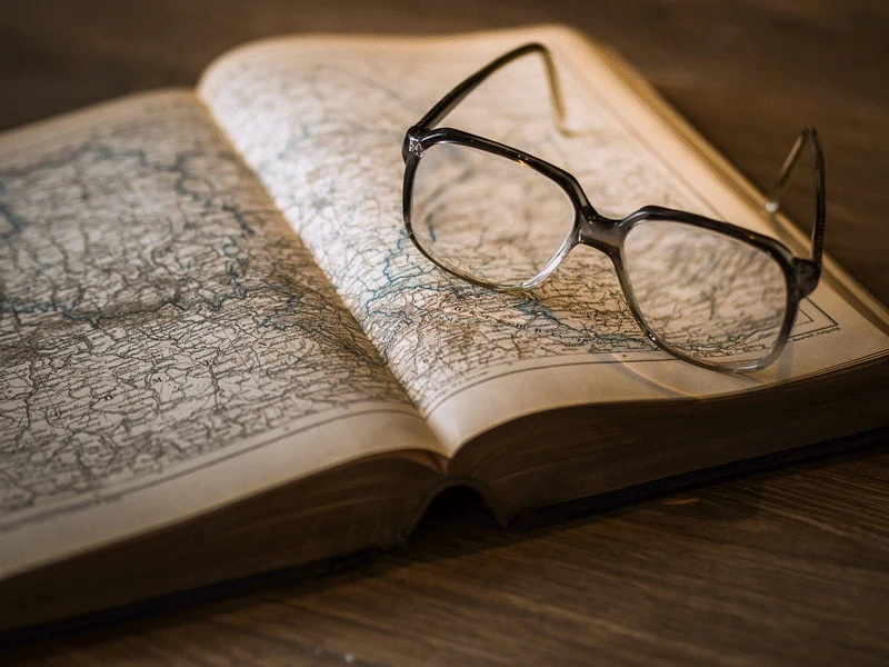 photo of map with glasses