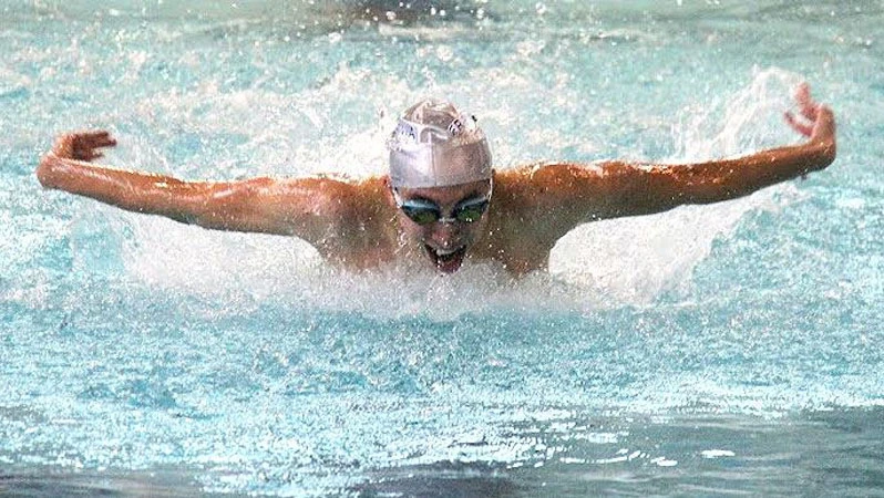 Tyler Conti swimming