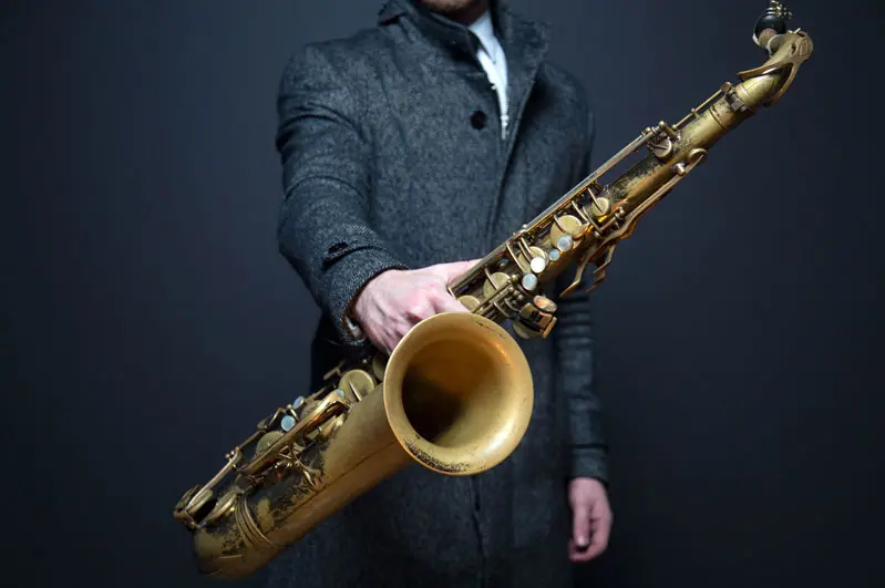picture of musician holding saxophone