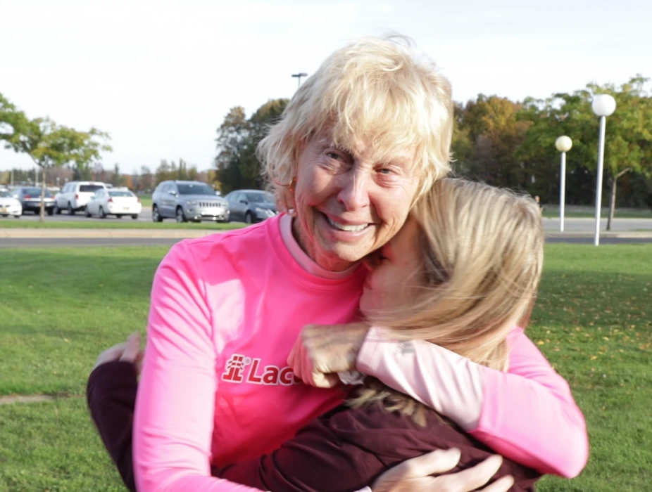 Carol "Stash" Stanley embraces student Genielle Byczynski, the first recipient of the scholarship "Stash" started in memory of her mother.