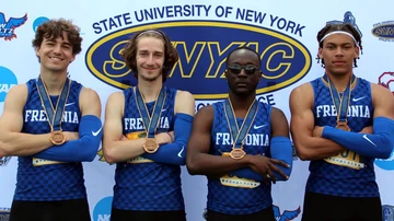 four track and field athletes with their medals