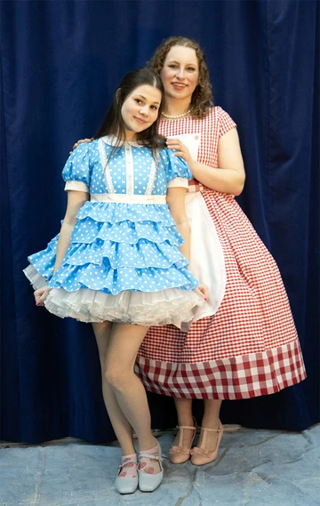 two female cast members in costume