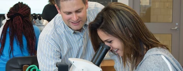 Dr. Scott Ferguson works with a student in the new Science Center.